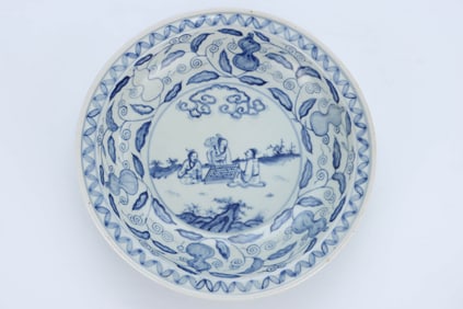 A BLUE AND WHITE 'FIGURES AND STORY' DISH