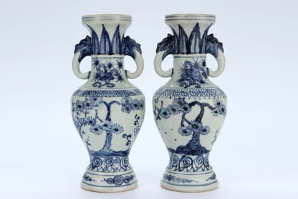 A PAIR OF BLUE AND WHITE 'PINE, BAMBOO AND PRUNUS' ELEPHANT-HANDLE VASES