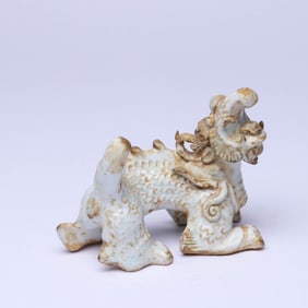 A WHITE-GLAZED FIGURE