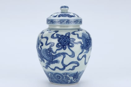 A BLUE AND WHITE 'LION AND BALL' COVERED JAR