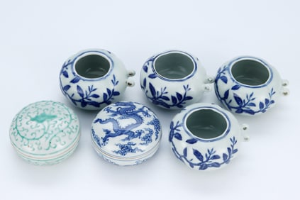 SIX BLUE AND WHITE BIRD FEEDERS AND COVERED BOXES