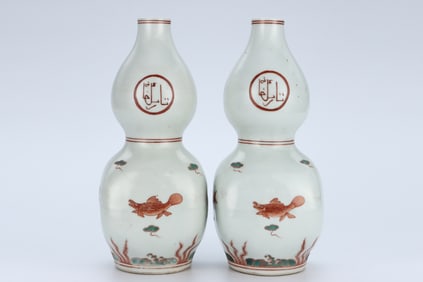 A PAIR OF IRON-RED 'FISH AND WATER WEEDS' GOURD-SHAPED VASES