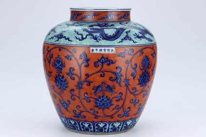 A BLUE AND WHITE AND IRON-RED 'INTERLOCKING LOTUS AND DRAGON' JAR