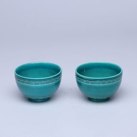 A PAIR OF PEACOCK BLUE-GLAZED 'WAVE' CUPS