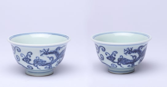 A PAIR OF BLUE AND WHITE 'CLOUD AND DRAGON' CUPS