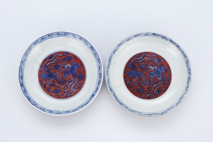 A PAIR OF BLUE AND WHITE AND IRON-RED 'DOUBLE PHOENIX AMONG FLOWERS' DISHES