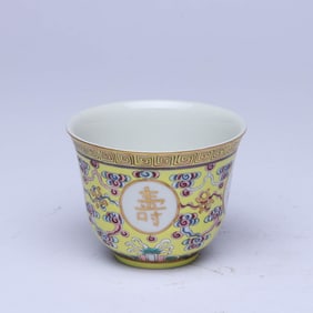 A YELLOW-GROUND FAMILLE ROSE MEDALLION  CUP