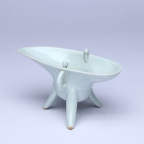 A WHITE-GLAZED CUP