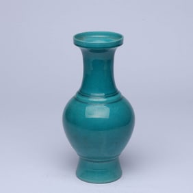 A PEACOCK GREEN-GLAZED DISH-MOUTH VASE