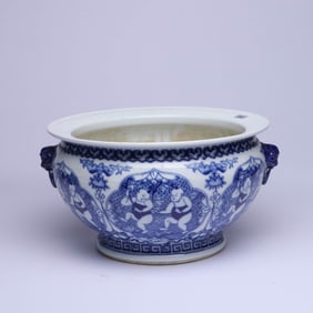 A BLUE AND WHITE 'LOTUS AND CHILD' BEAST-MASK JAR