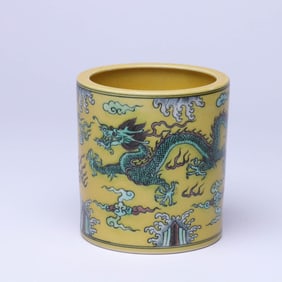 A YELLOW-GROUND SANCAI 'CLOUD AND DRAGON' BRUSH POT