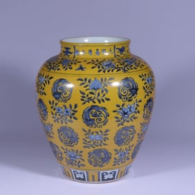 A YELLOW-GROUND BLUE AND WHITE 'FLOWER AND FRUIT SPRAYS AND ROUNDEL DRAGON' LARGE JAR