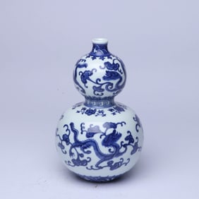 A BLUE AND WHITE 'WAVES AND DRAGON' GOURD-SHAPED VASE