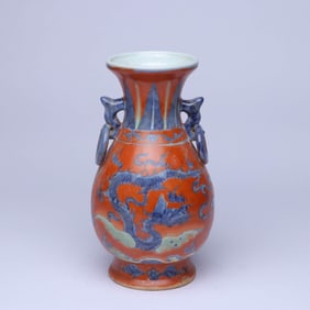A RED-GROUND BLUE AND WHITE 'CLOUD AND DRAGON' DOUBLE-HANDLE VASE