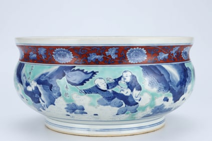 A BLUE AND WHITE AND IRON-RED 'INFANTS PLAYING' LUOHAN CENSER