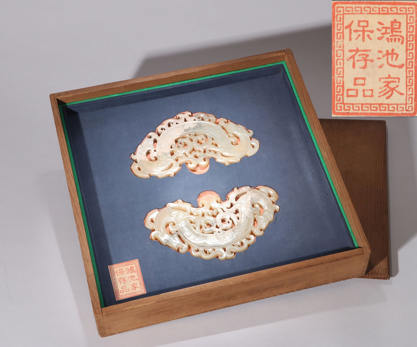 A PAIR OF DOUBLE-DRAGON JADE PENDANTS (1 of 13)