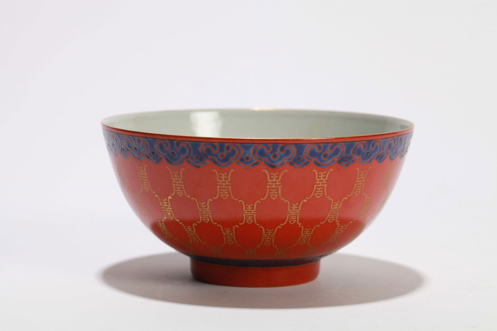 A CORAL RED-GLAZED 'SHOU CHARACTER' BOWL: A CORAL RED-GLAZED 'SHOU CHARACTER' BOWL Diameter: 12.5 cm (4.92 in.) x Height: 6.5 cm (2.56 in.). All measurements are approximate.