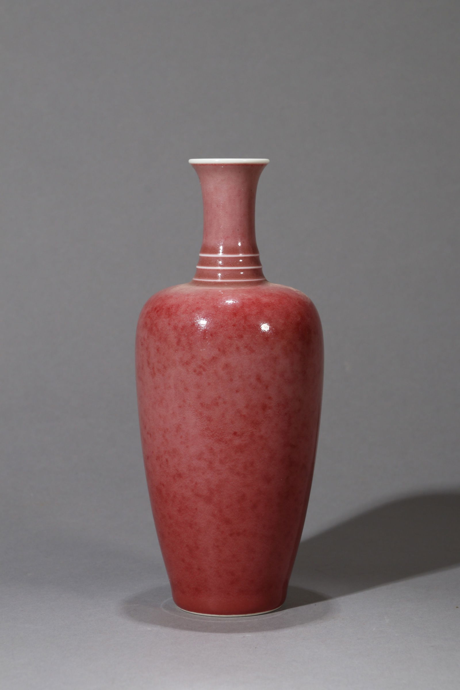 A PEACHBLOOM-GLAZED RADISH-SHAPED VASE: A PEACHBLOOM-GLAZED RADISH-SHAPED VASE Height: 20 cm (7.87 in.). All measurements are approximate.