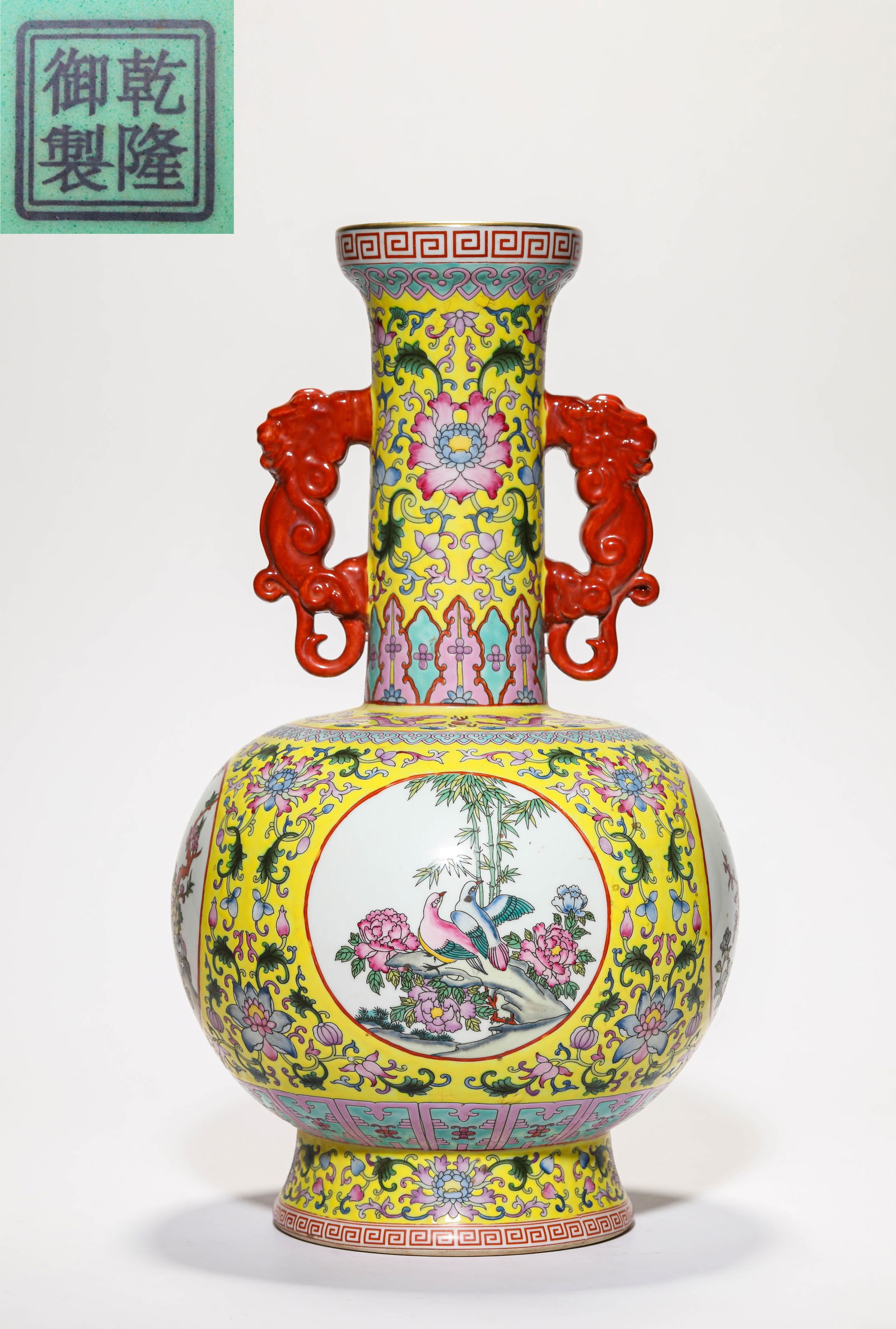 A FAMILLE ROSE MEDALLION 'FLOWERS AND BIRDS' CHI-DRAGON HANDLE VASE: A FAMILLE ROSE MEDALLION 'FLOWERS AND BIRDS' CHI-DRAGON HANDLE VASE Height: 38 cm (14.96 in.). All measurements are approximate.