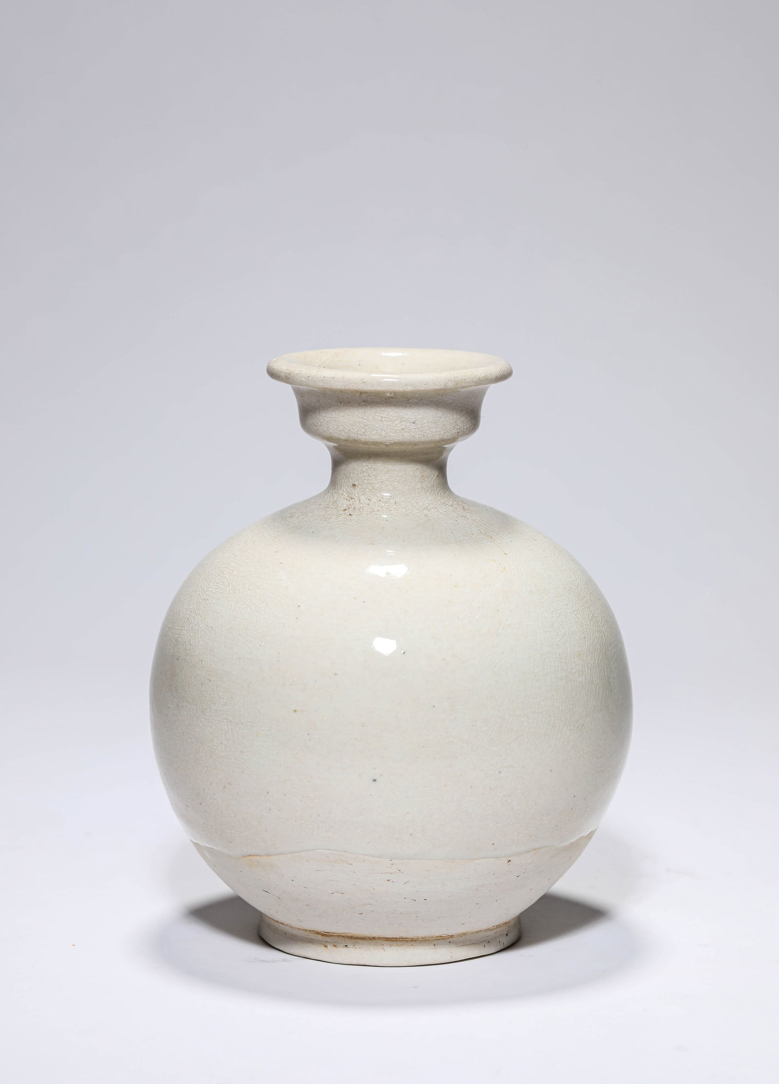 A WHITE PORCELAIN VASE: A WHITE PORCELAIN VASE Dimensions: Width: 12.2 cm (4.80 in) x Height: 14.8 cm (5.83 in). All measurements are approximate.