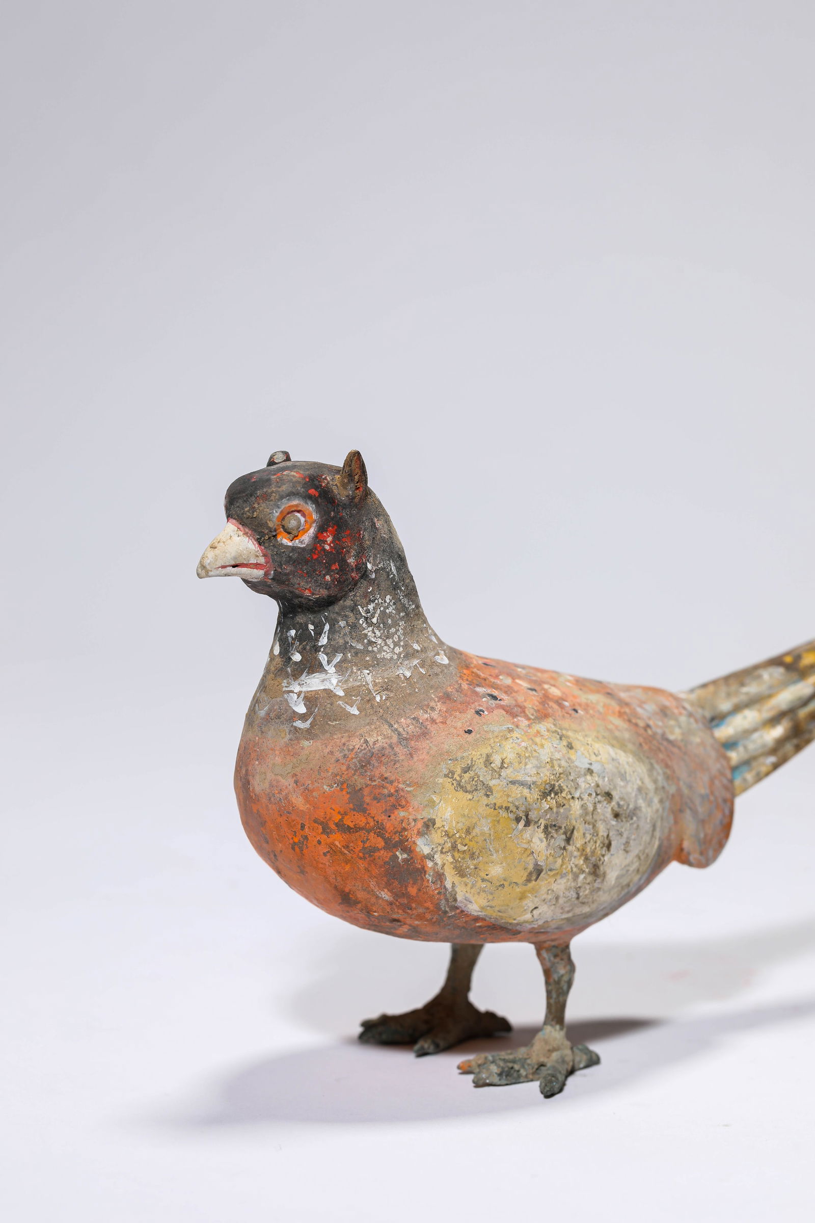 A PAINTED POTTERY BIRD - 2