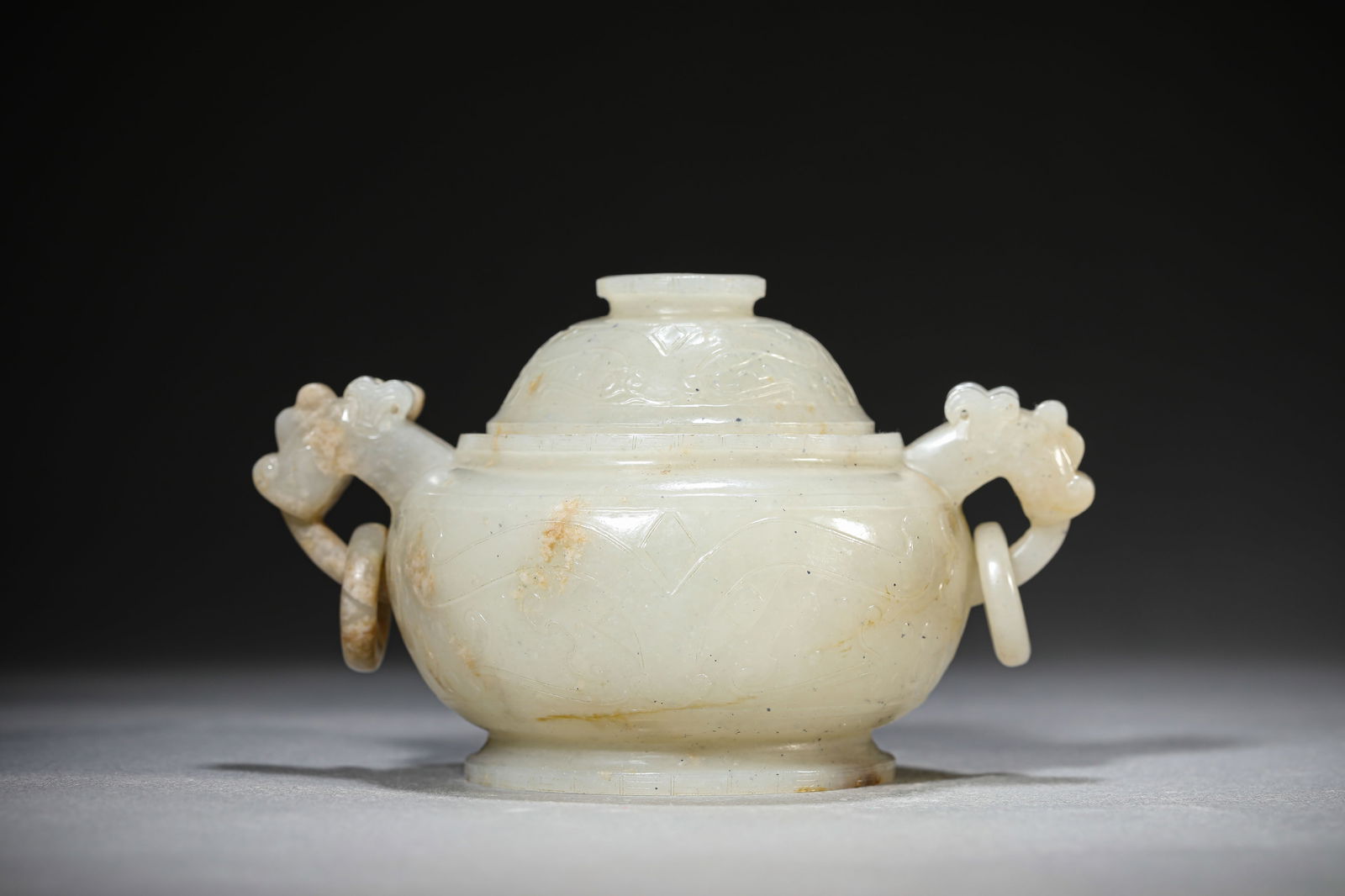 A JADE 'ANIMAL MASK' CENSER: A JADE 'ANIMAL MASK' CENSER Dimensions: Length: 13.9 cm (5.47 in) x Width: 9.5 cm (3.74 in) x Height: 8.2 cm (3.23 in). All measurements are approximate.