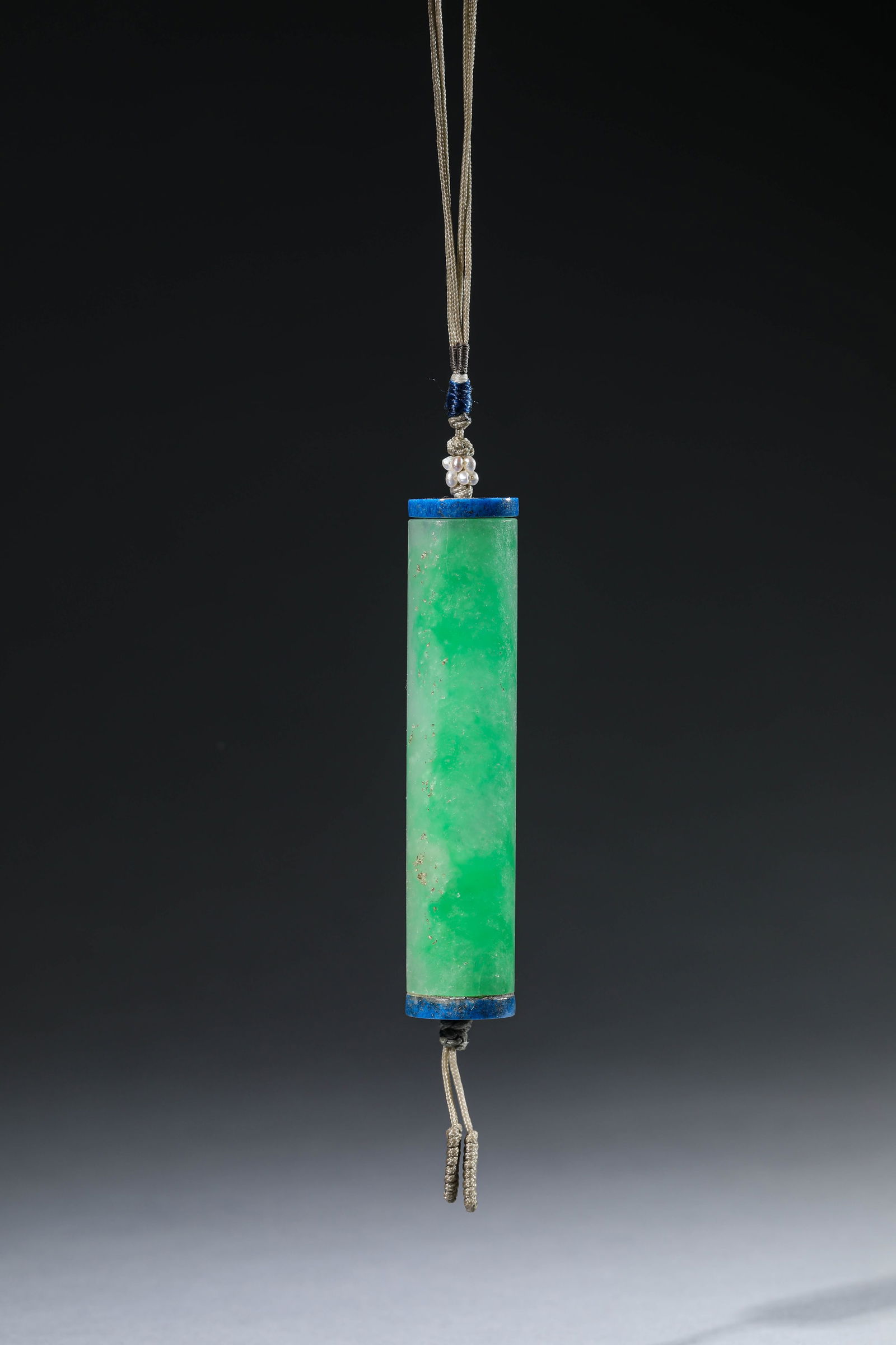 A JADEITE 'LEI ZI' ORNAMENT: A JADEITE 'LEI ZI' ORNAMENT Dimensions: Width: 1.8 cm (0.71 in) x Height: 8.4 cm (3.31 in). All measurements are approximate.