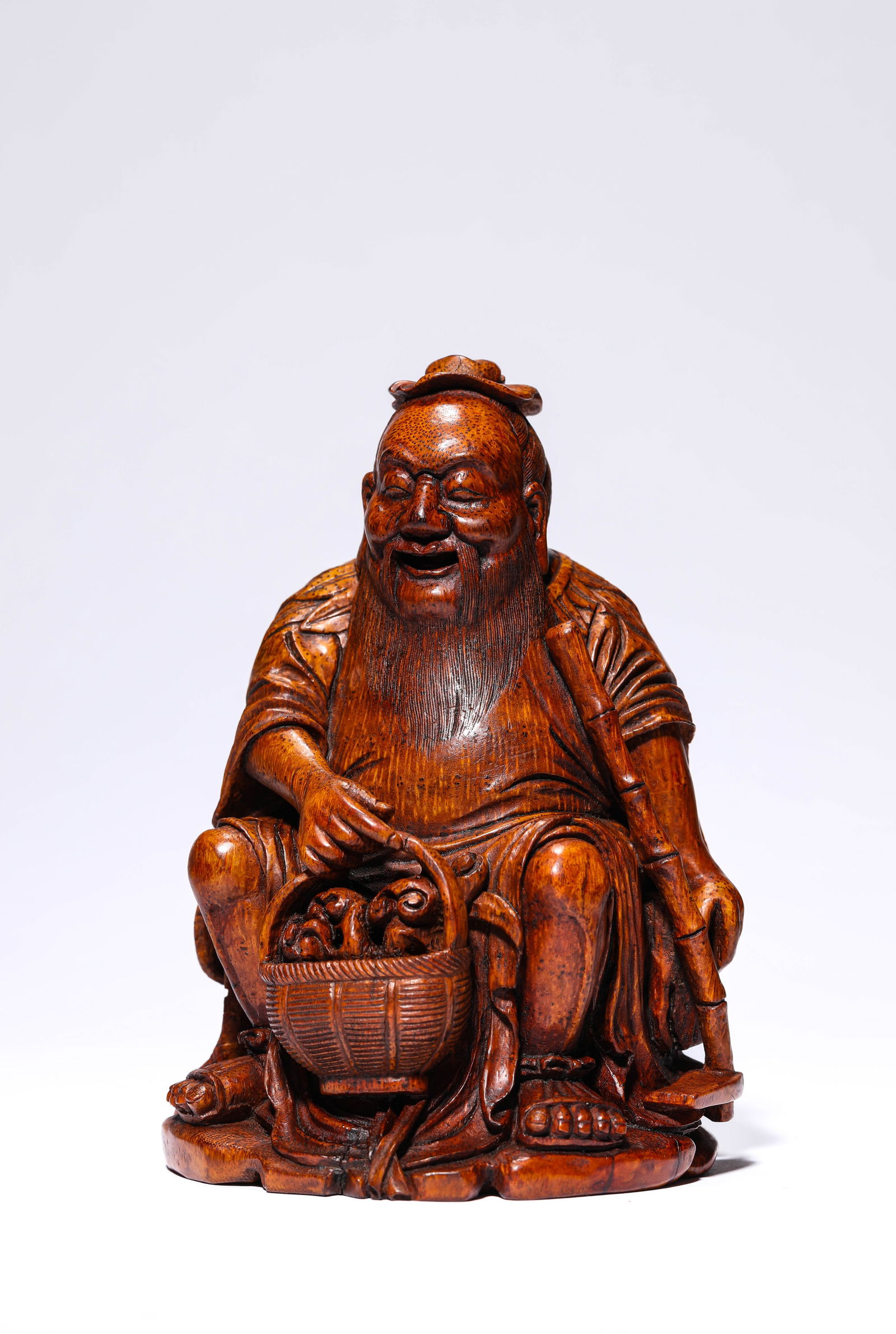 A BAMBOO 'FIGURAL' CARVING: A BAMBOO 'FIGURAL' CARVING Dimensions: Length: 11.2 cm (4.41 in) x Width: 10.3 cm (4.06 in) x Height: 15.6 cm (6.14 in). All measurements are approximate.