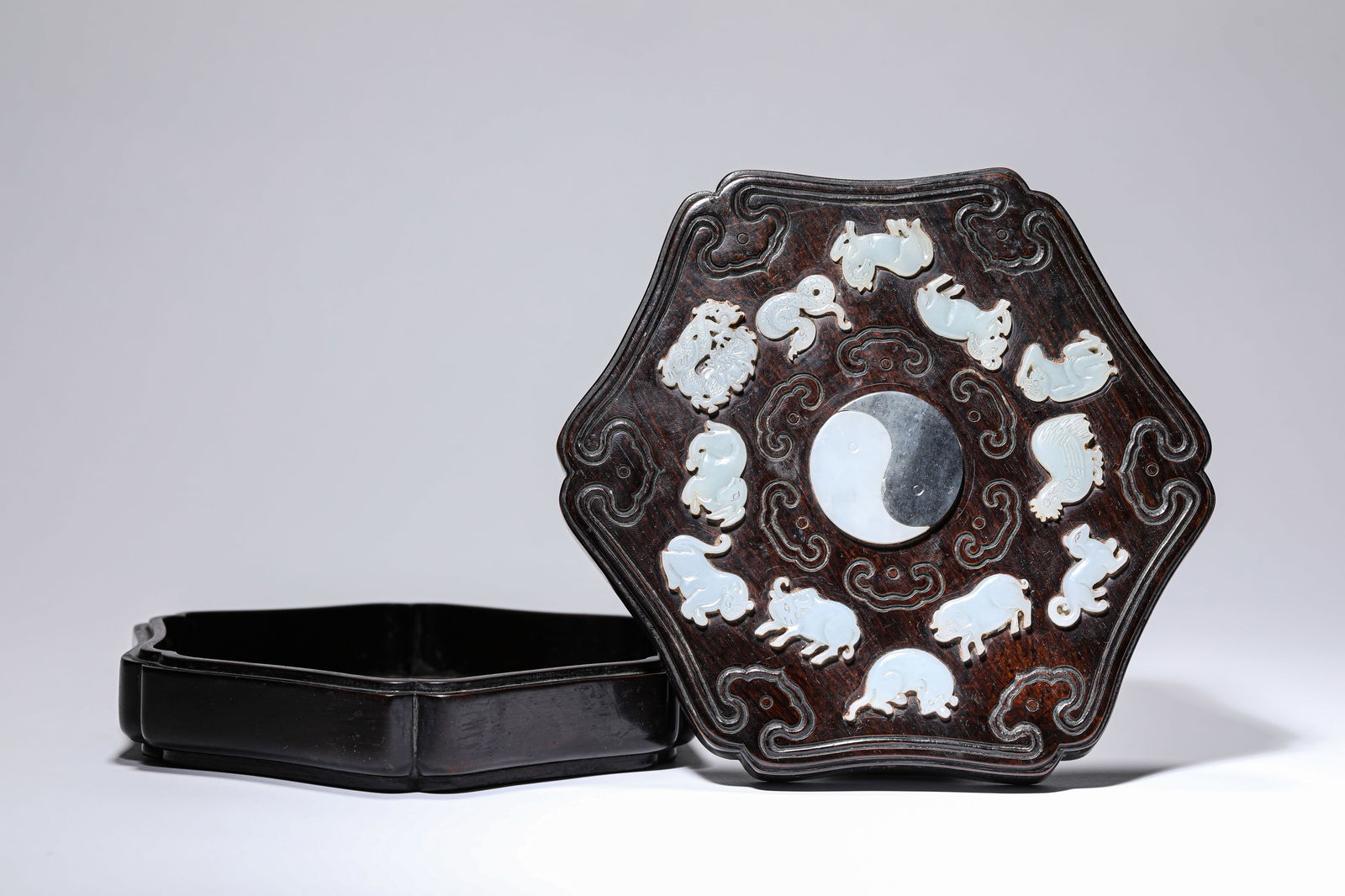 A WOOD AND JADE-INLAID COVERED BOX: A WOOD AND JADE-INLAID COVERED BOX Dimensions: Length: 18.5 cm (7.28 in) x Width: 17.3 cm (6.81 in) x Height: 6.0 cm (2.36 in). All measurements are approximate.