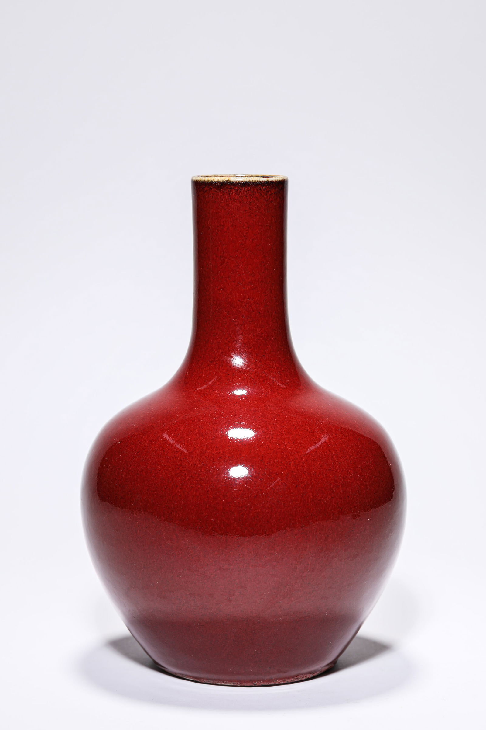 A LANGYAO RED-GLAZED 'TIANQIU' VASE: A LANGYAO RED-GLAZED 'TIANQIU' VASE Dimensions: Width: 15.2 cm (5.98 in) x Height: 23.0 cm (9.06 in). All measurements are approximate.