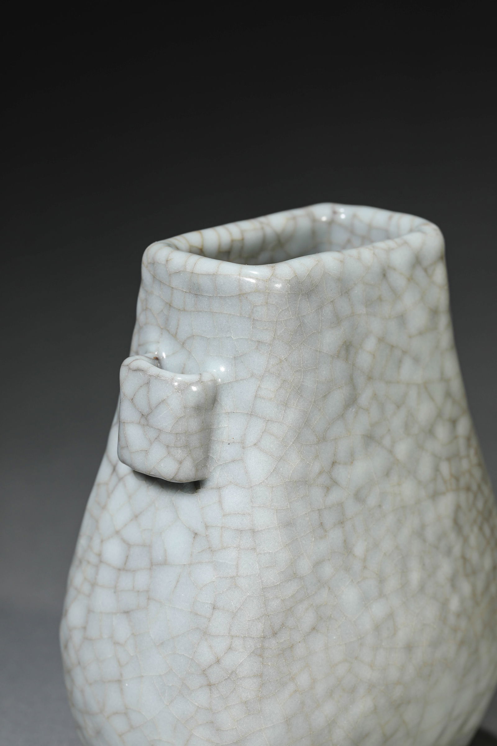 A GUAN-TYPE VASE WITH 'TUBE HANDLES': A GUAN-TYPE VASE WITH 'TUBE HANDLES' Dimensions: Length: 8.6 cm (3.39 in) x Width: 6.1 cm (2.40 in) x Height: 10.3 cm (4.06 in). All measurements are approximate.