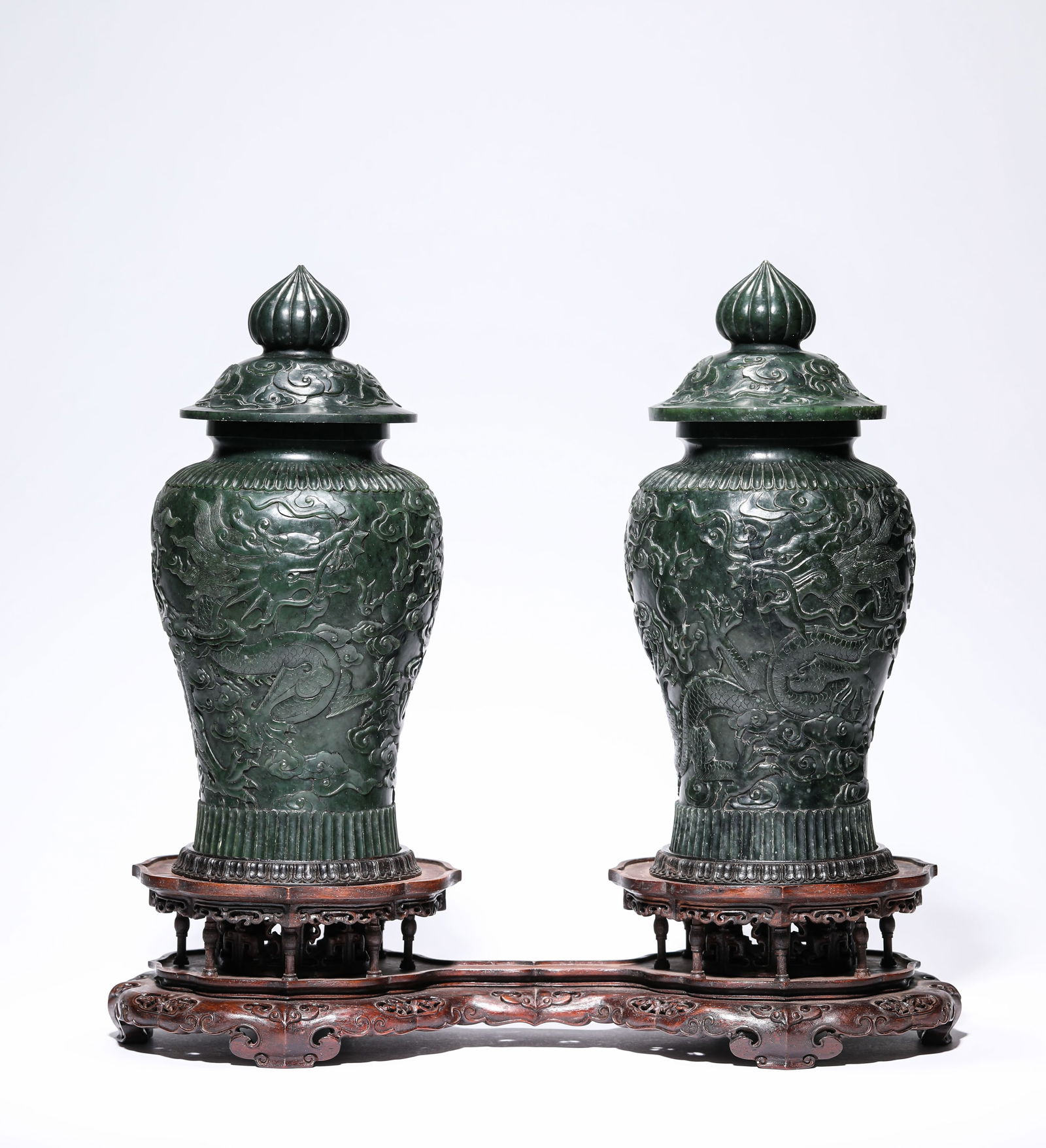A PAIR OF SPINACH JADE 'TWO DRAGONS CHASING A PEARL' VASES (1 of 7)