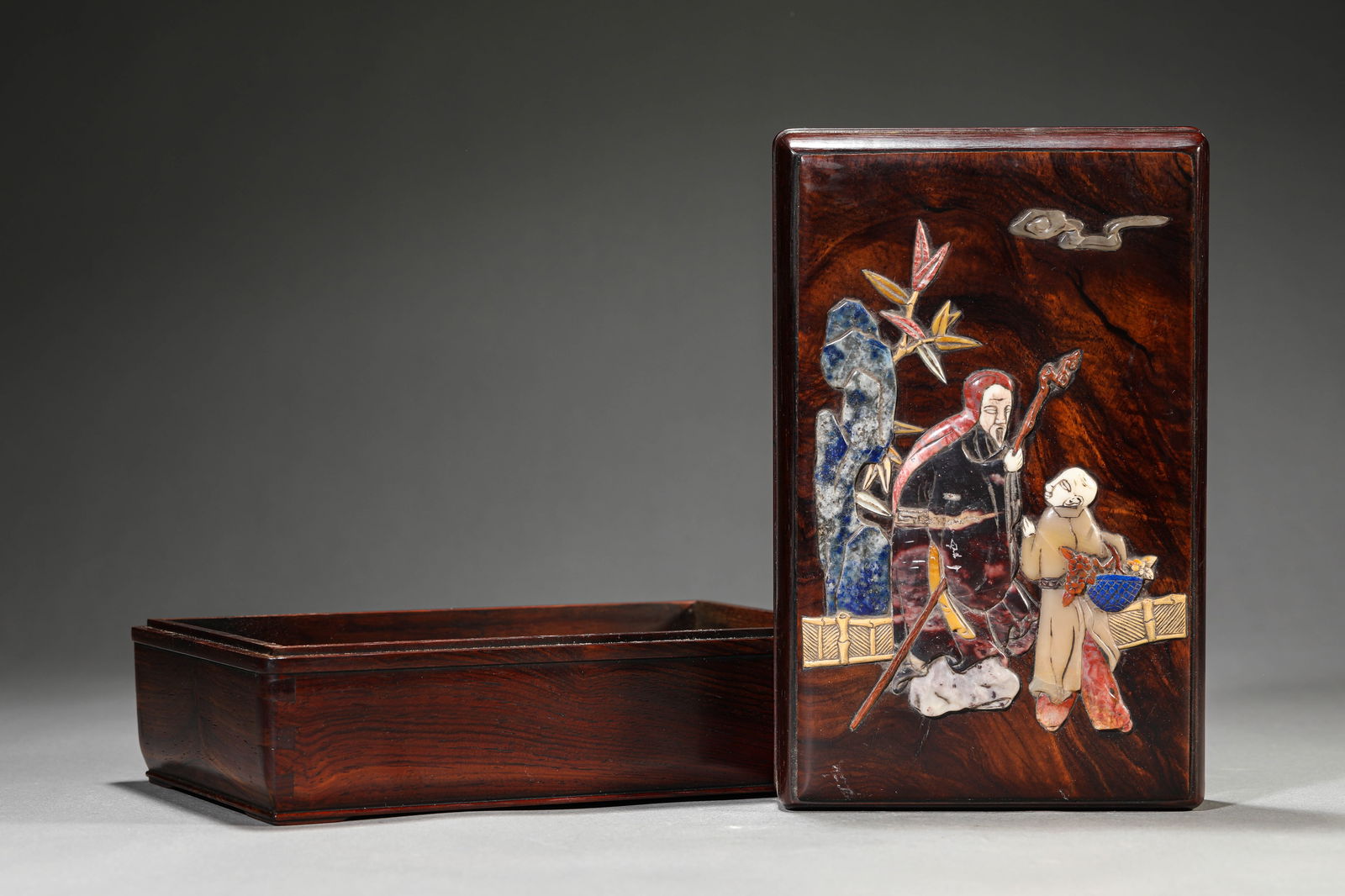 A HUANGHUALI WOOD AND MOTHER-OF-PEARL-INLAID COVERED BOX: A HUANGHUALI WOOD AND MOTHER-OF-PEARL-INLAID COVERED BOX Dimensions: Length: 21.7 cm (8.54 in) x Width: 13.7 cm (5.39 in) x Height: 8.8 cm (3.46 in). All measurements are approximate.