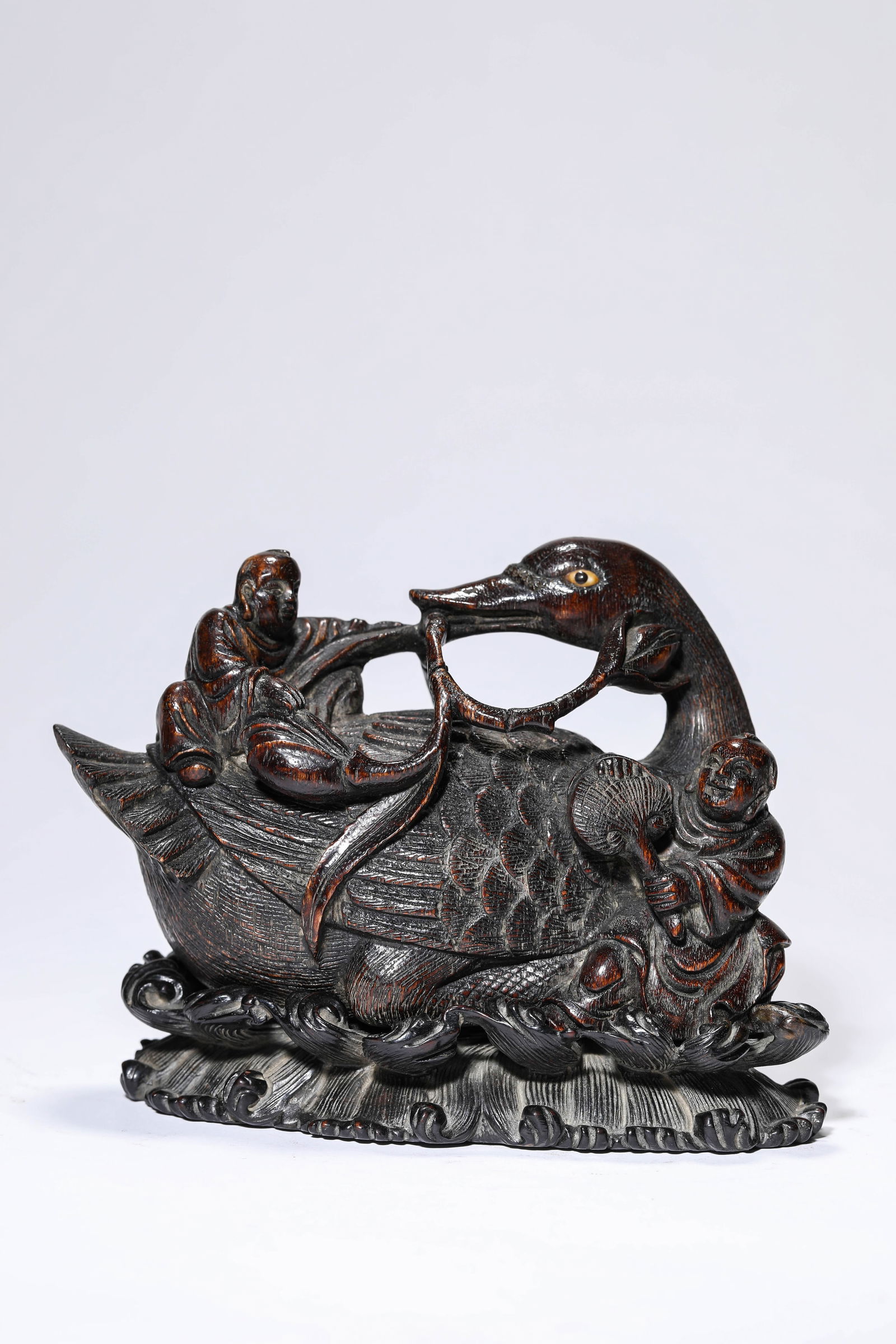 A WOOD 'CARVED BOY PLAYING WITH A GOOSE': A WOOD 'CARVED BOY PLAYING WITH A GOOSE' Dimensions: Length: 15.0 cm (5.91 in) x Width: 7.6 cm (2.99 in) x Height: 9.7 cm (3.82 in). All measurements are approximate.