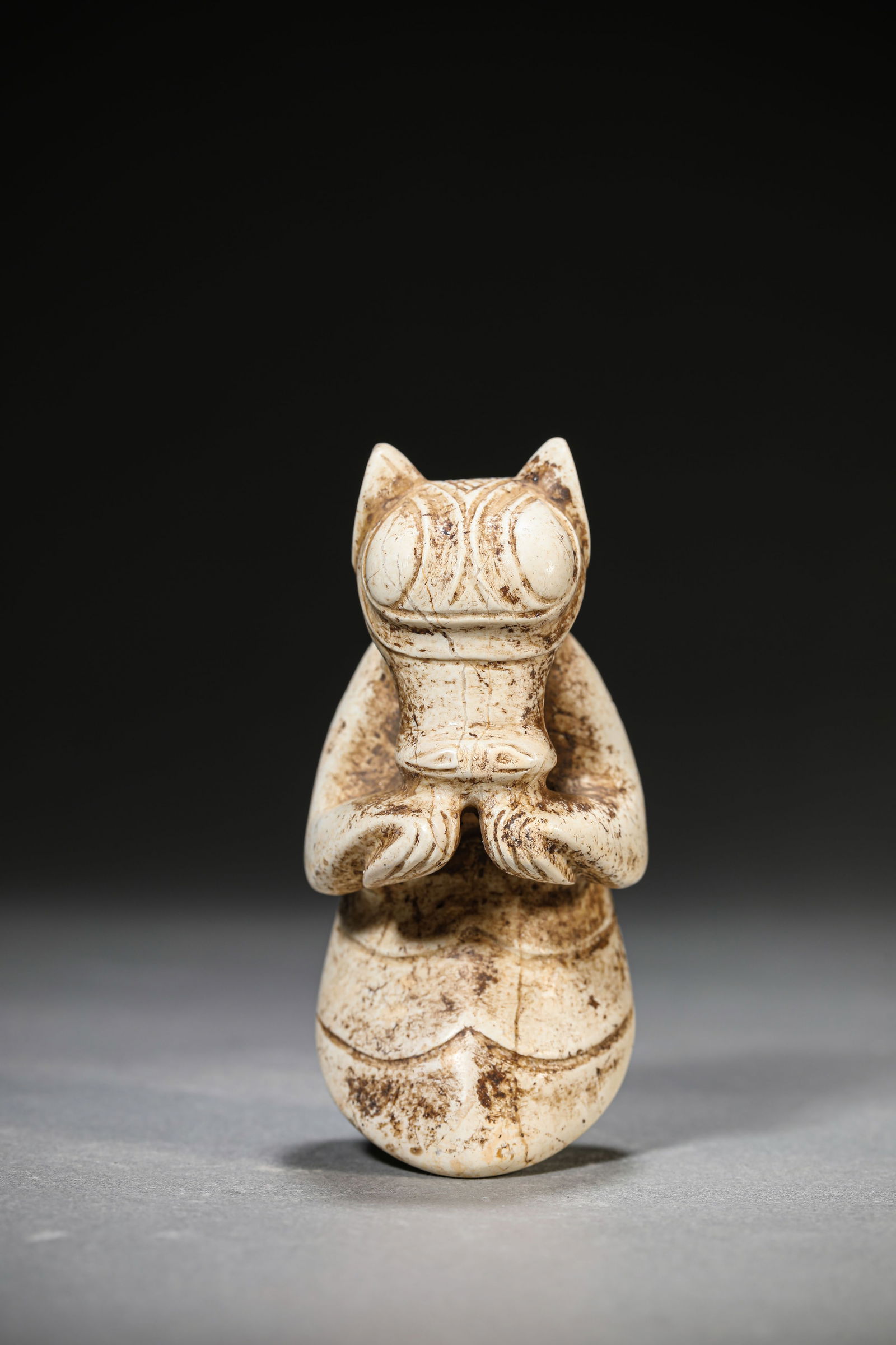 A JADE FIGURE: A JADE FIGURE Dimensions: Length: 4.4 cm (1.73 in) x Width: 4.6 cm (1.81 in) x Height: 9.4 cm (3.70 in). All measurements are approximate.