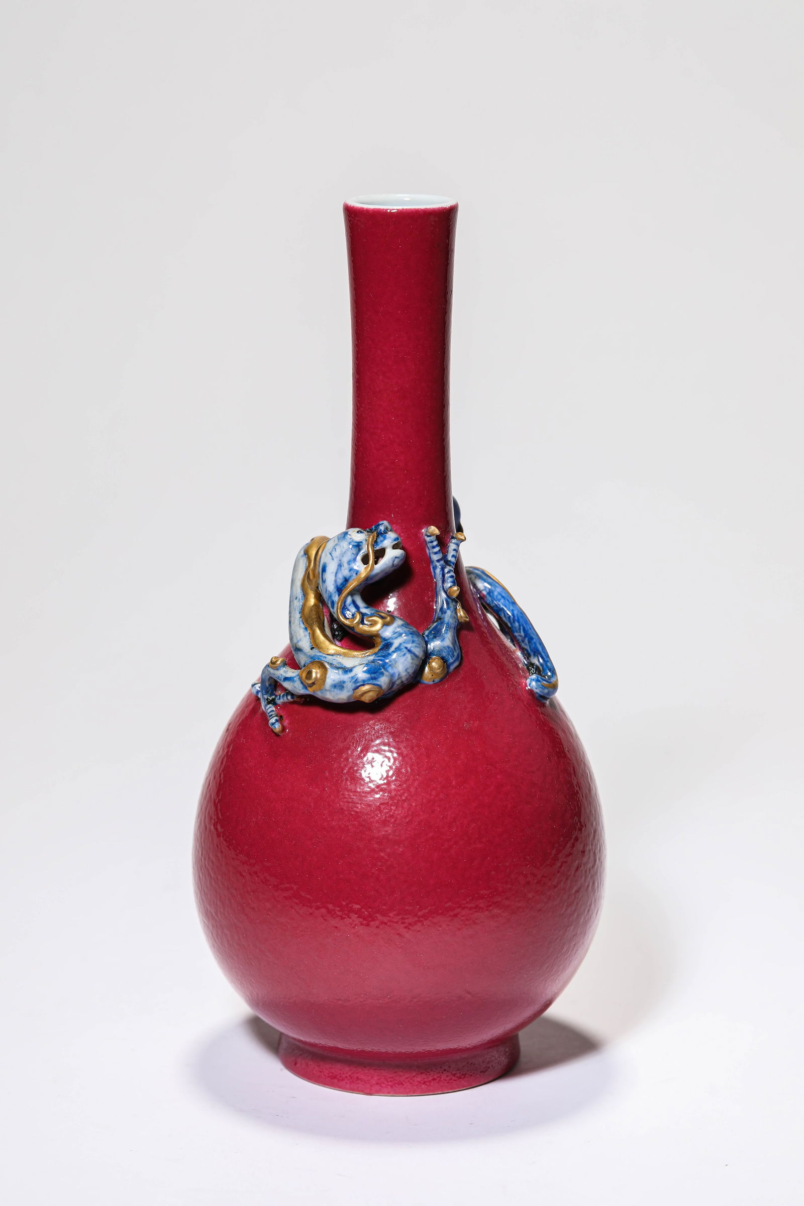 A ROUGE-GLAZED 'APPLIQUé DRAGON' VASE: A ROUGE-GLAZED 'APPLIQUé DRAGON' VASE Dimensions: Width: 10.9 cm (4.29 in) x Height: 22.5 cm (8.86 in). All measurements are approximate.