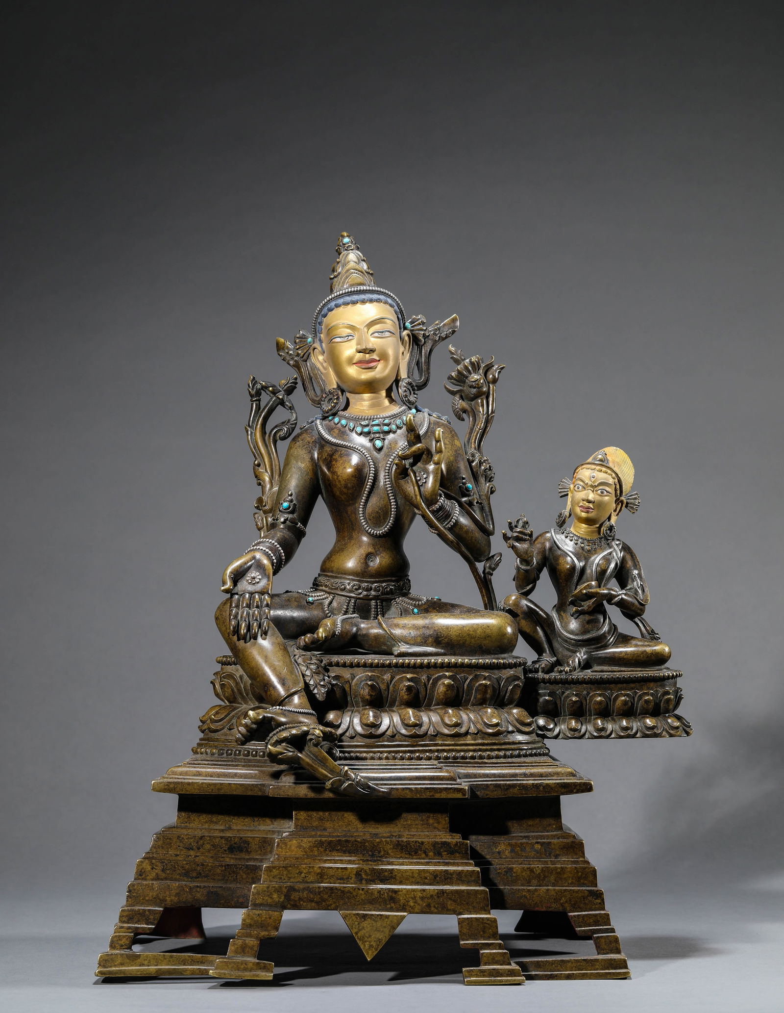 A 'TIBETAN PALA-STYLE' ALLOY BRONZE, TURQUOISE AND SILVER-INLAID FIGURE OF GREEN TARA: A 'TIBETAN PALA-STYLE' ALLOY BRONZE, TURQUOISE AND SILVER-INLAID FIGURE OF GREEN TARA Dimensions: Weight: 12.85kg. Length: 37.5 cm (14.76 in) x Width: 22.8 cm (8.98 in) x Height: 48.8 cm (19.21 in).
