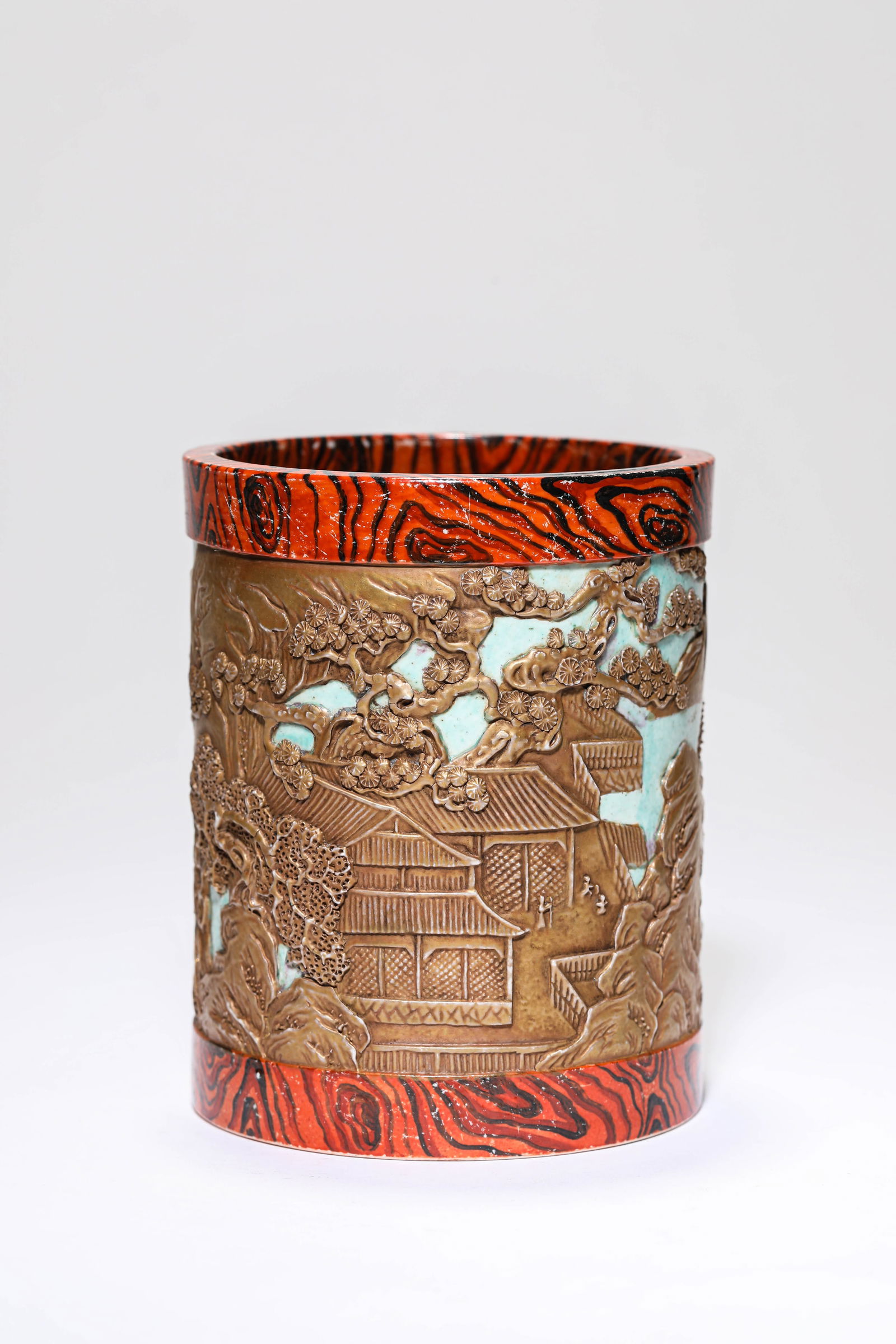 A WOOD-GRAIN-GLAZED'LANDSCAPE AND FIGURES' BRUSH POT: A WOOD-GRAIN-GLAZED'LANDSCAPE AND FIGURES' BRUSH POT Dimensions: Width: 10.1 cm (3.98 in) x Height: 12.6 cm (4.96 in). All measurements are approximate.
