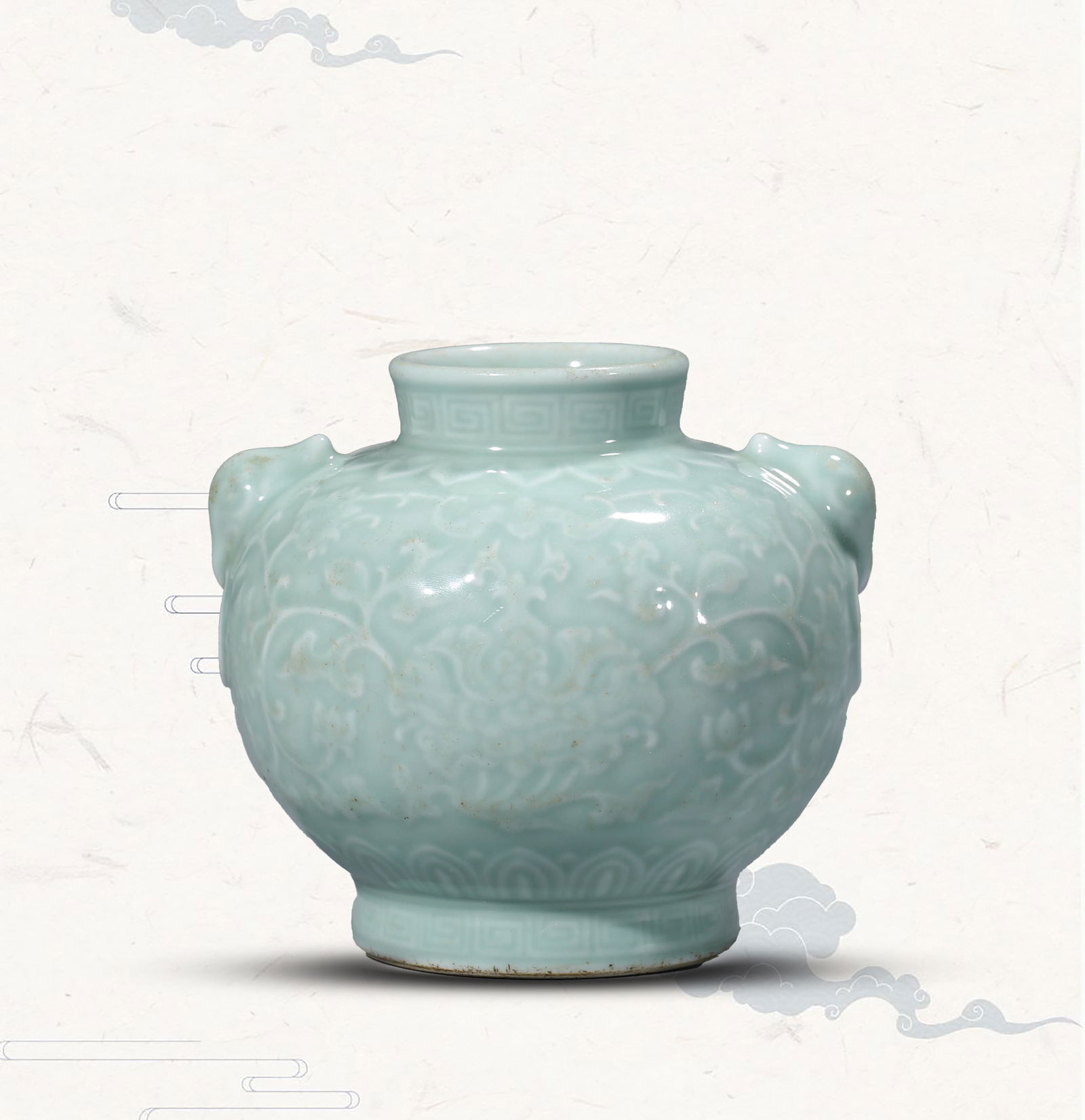 A CELADON-GLAZED 'RELIEF-DECORATED' JAR: A CELADON-GLAZED 'RELIEF-DECORATED' JAR Dimensions: Length: 13.9 cm (5.47 in) x Width: 13.4 cm (5.28 in) x Height: 12.5 cm (4.92 in). All measurements are approximate.
