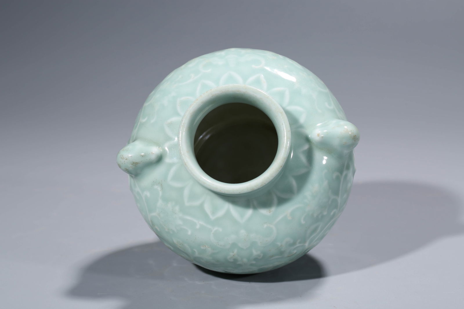 A CELADON-GLAZED 'RELIEF-DECORATED' JAR - 7