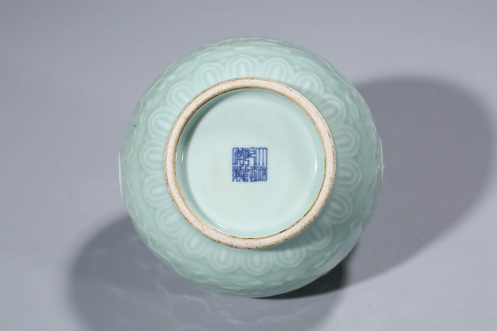 A CELADON-GLAZED 'RELIEF-DECORATED' JAR - 8