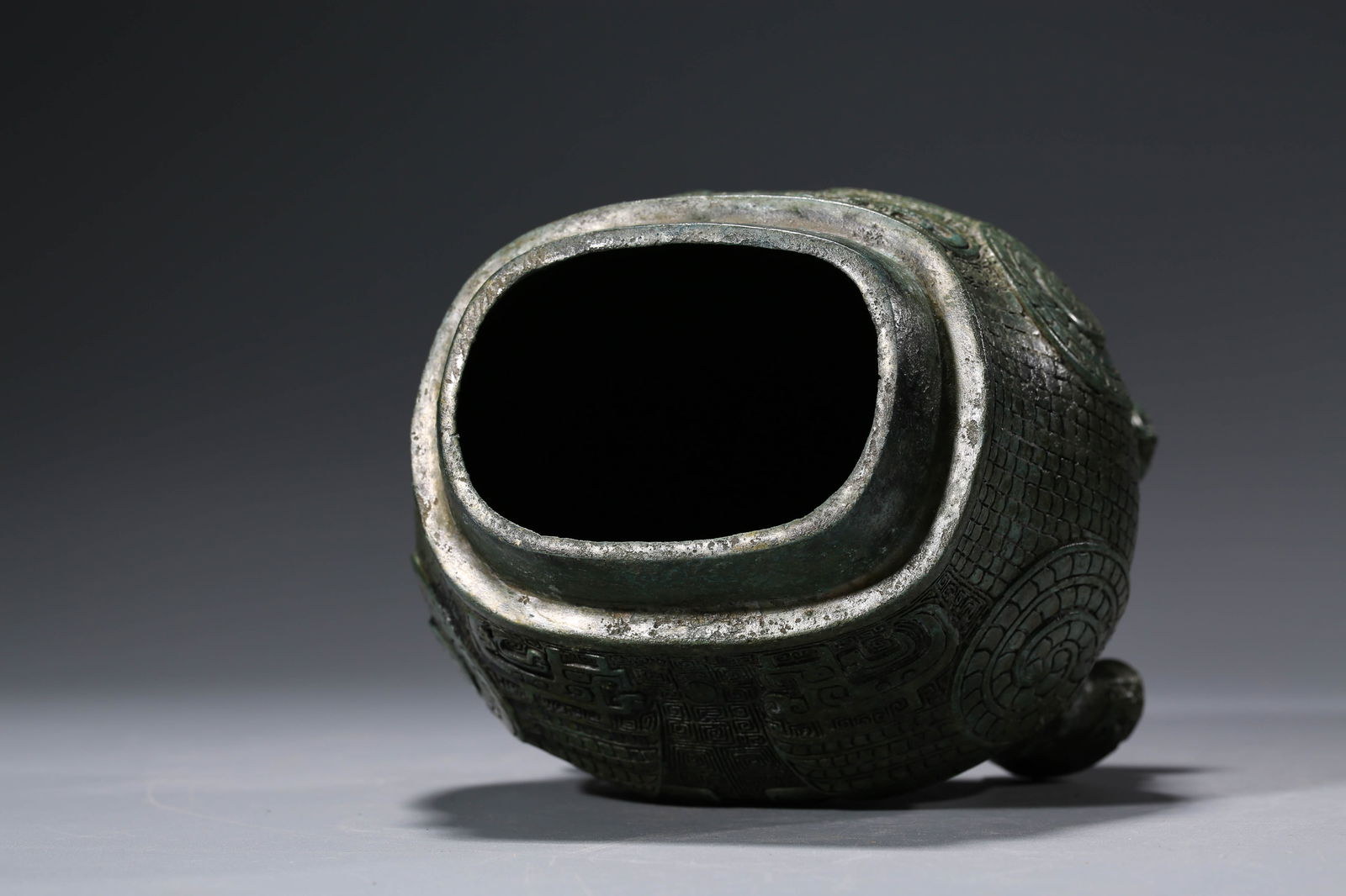 A BRONZE 'EAGLE-BEAK' ZUN - 7