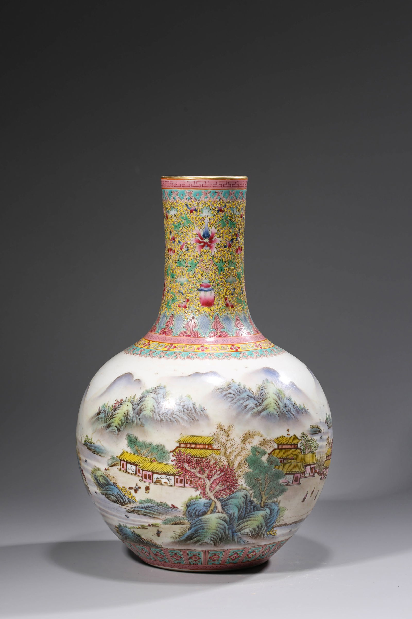 A FAMILLE-ROSE 'LANDSCAPE AND FIGURES' CORAL-GROUND BOTTLE VASE (1 of 11)