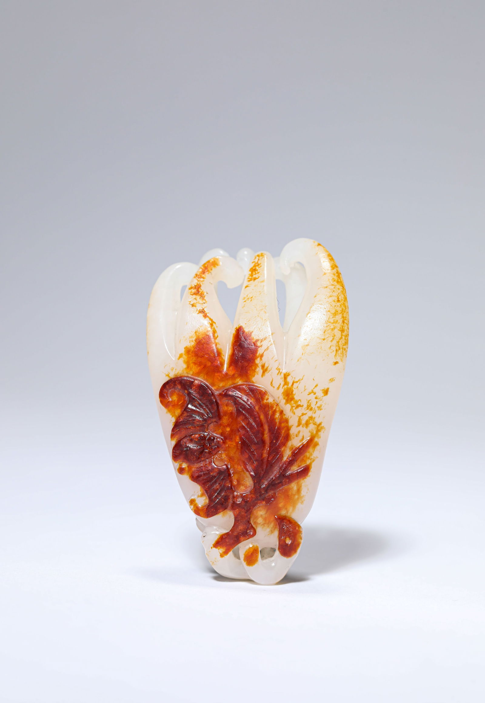 A JADE 'FINGERED CITRON': A JADE 'FINGERED CITRON' Dimensions: Length: 3.7 cm (1.46 in) x Width: 2.3 cm (0.91 in) x Height: 6.2 cm (2.44 in). All measurements are approximate.