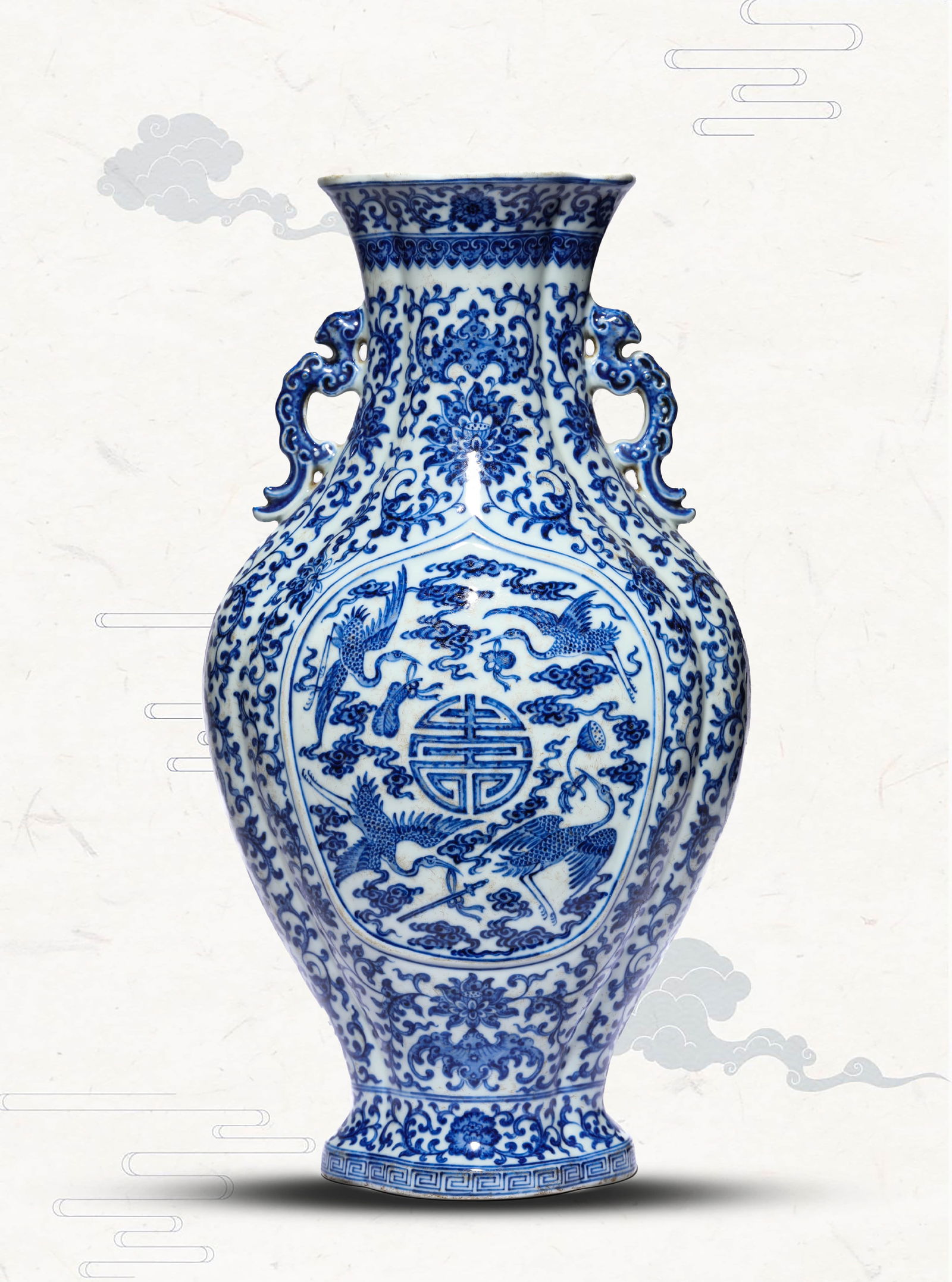 A BLUE AND WHITE 'INTERLOCKING LOTUS, BAT AND SHOU' VASE (1 of 7)