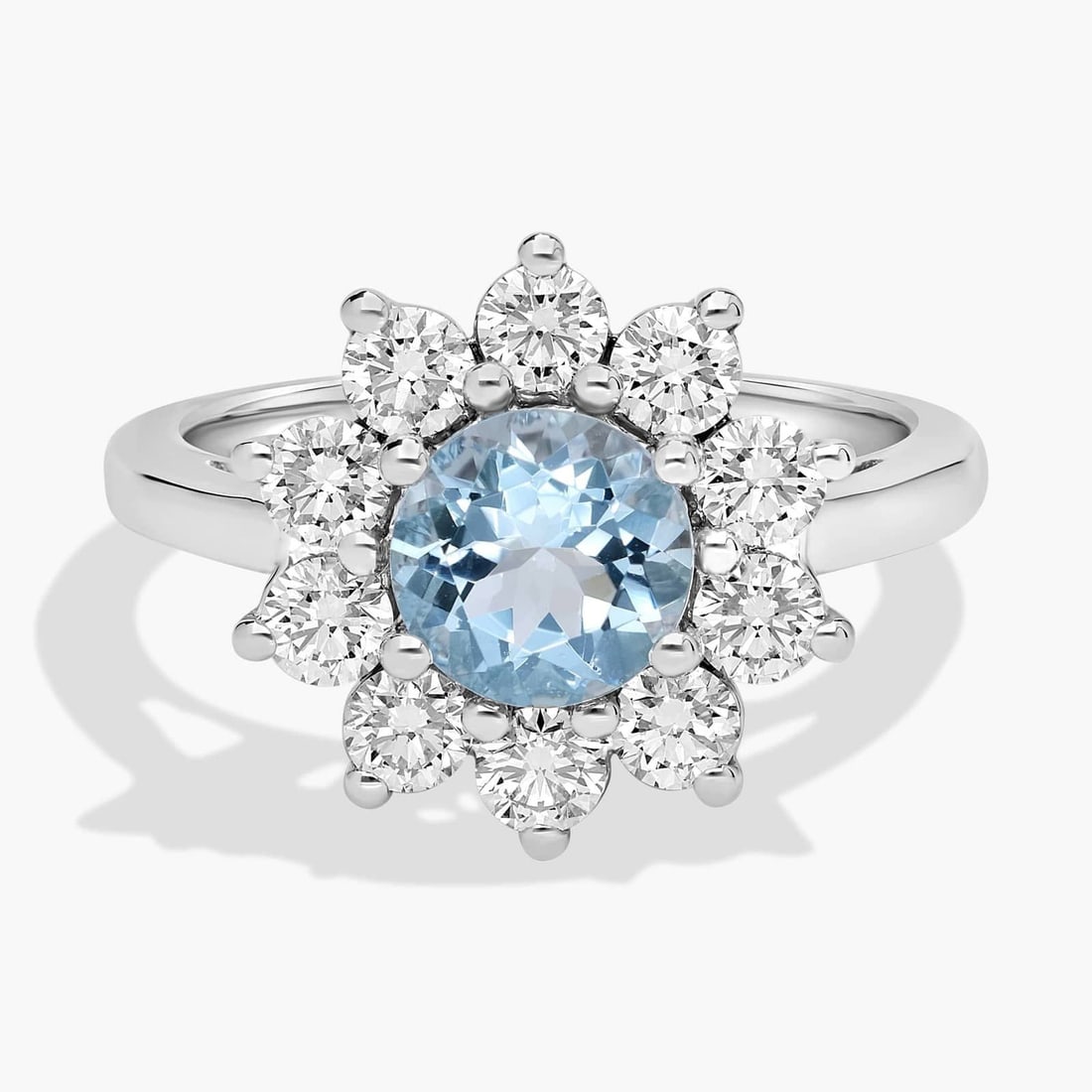 ROUND AQUAMARINE AND DIAMOND HALO RING IN 14K WHITE GOLD: ROUND AQUAMARINE AND DIAMOND HALO RING IN 14K WHITE GOLDDescription:This aquamarine and diamond halo ring combines a colorful center gemstone with the brilliance of diamonds. Add this sparkling ring