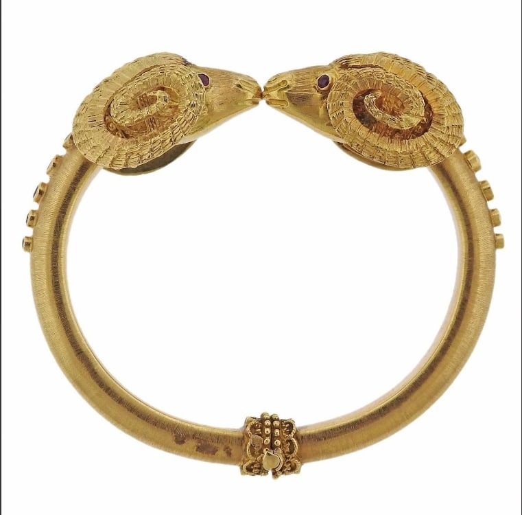 AN 18K YELLOW GOLD BRACELET SET WITH RUBIES AND SAPPHIRES (1 of 1)