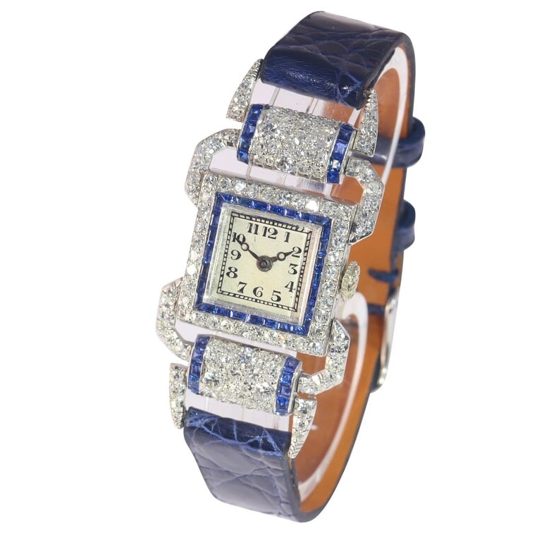 ANTIQUE WATCH WITH FULL DIAMOND AND SAPPHIRE CRYSTALS, DATING FROM THE MID-20TH CENTURY ART DECO: ANTIQUE WATCH WITH FULL DIAMOND AND SAPPHIRE CRYSTALS, DATING FROM THE MID-20TH CENTURY ART DECO STYLE. Description: Crafted in platinum/18K white gold with full diamond and sapphire settings, the cas