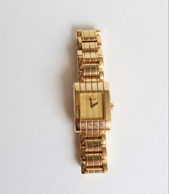 BOUCHERON PARALLEL COLLECTION WATCH, 18K GOLD, DECORATED WITH RAISED PATTERNS: BOUCHERON PARALLEL COLLECTION WATCH, 18K GOLD, DECORATED WITH RAISED PATTERNS Description: The case and strap are crafted from 18K gold, with a rich gold color and a heavy texture, reflecting Bouchero