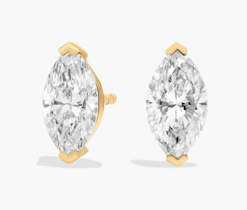 MARQUISE CUT DIAMOND STUD EARRINGS IN 14K YELLOW GOLD: MARQUISE CUT DIAMOND STUD EARRINGS IN 14K YELLOW GOLD Description: Sparkle with every movement of your head when you wear these classic stud earrings set with marquise-cut diamonds. The 14k yellow gol